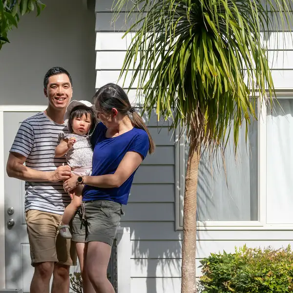 Family in front of the house