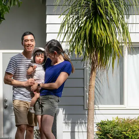 Family in front of the house