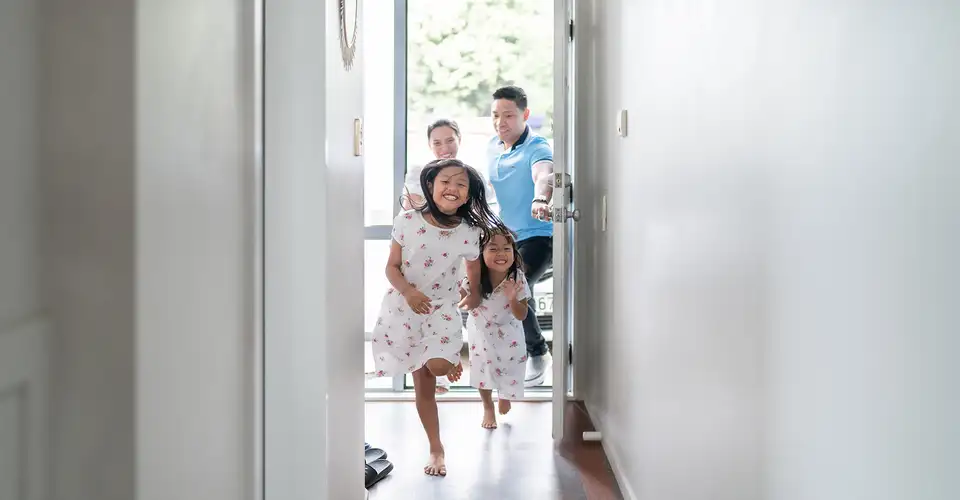 Family running into house