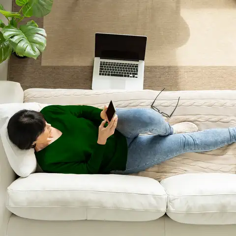 Lady on couch green