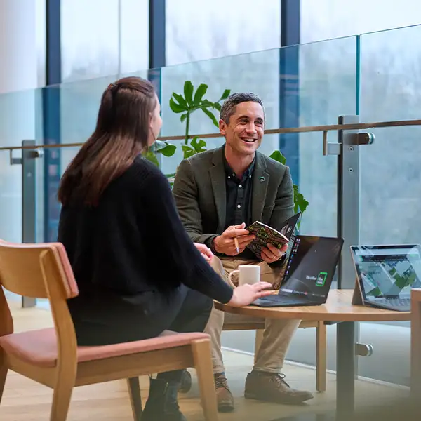 Kiwibank staff laughing in office