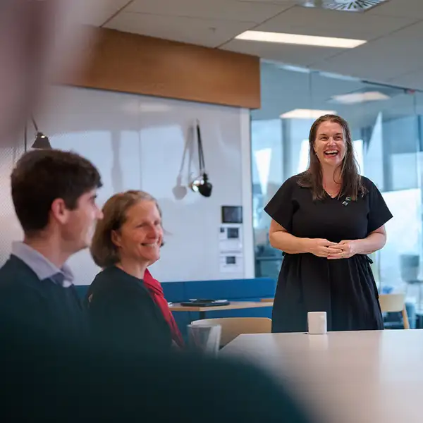 Kiwibankers laughing with Charlotte Ward