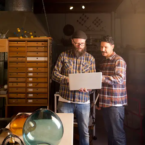 Two men and laptop