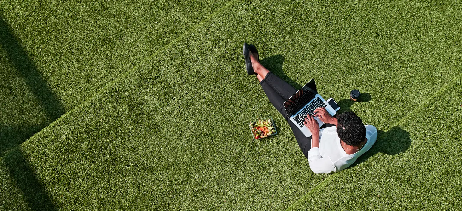 Lady on laptop in backyard