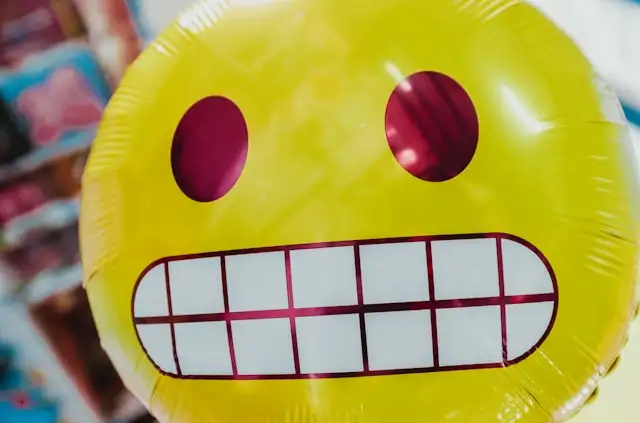 Image of an awkward emoji balloon