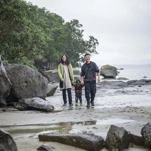 family walking on beach