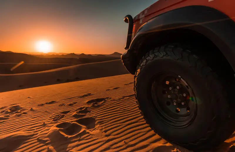 Image of truck wheel in desert